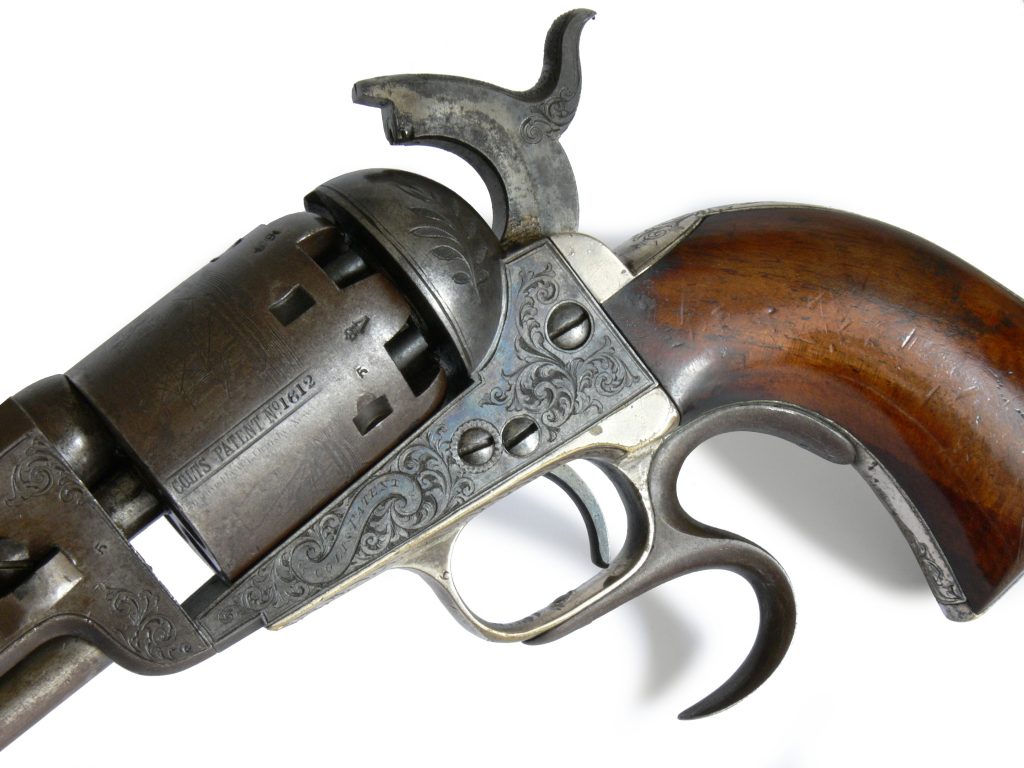 Detail of engraving on Colt Navy model revolver