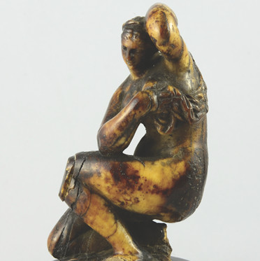 An ivory statue of Venus crouching